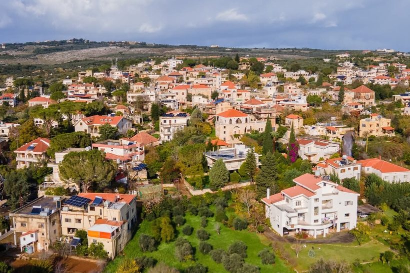 Rooftops of Bterram in the Koura, with the mountains of North Lebanon behind.